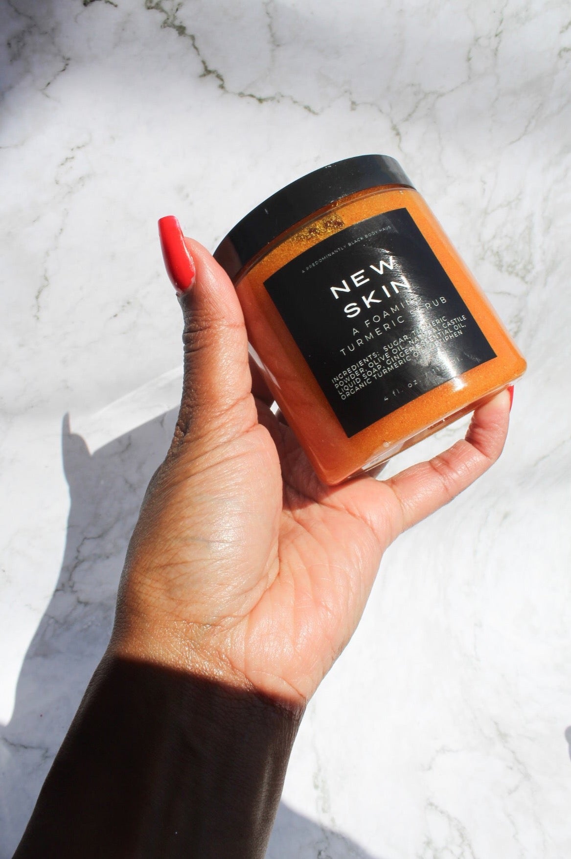 NEW SKIN, A FOAMING TURMERIC SCRUB